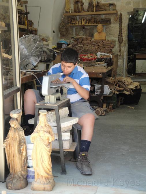 IMG_7035 DSC04672.JPG - Young boy working at Olivewood Factory